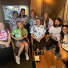 Bales lab personnel gathered around Isabel Kier in matching tie-dyed t-shirts